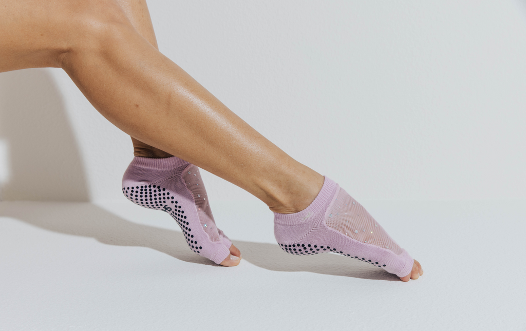 light pink grip socks worn for reformer pilates
